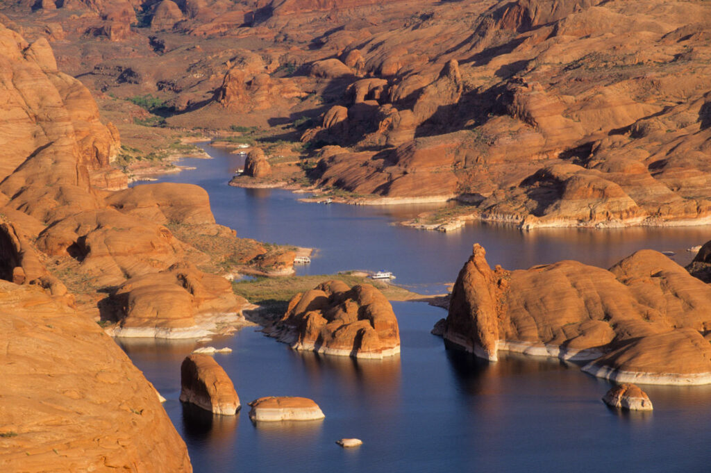 Lake Powell in Utah stores water from the Upper Colorado Basin for delivery to Lake Mead, the key reservoir on the Colorado. In the last water year, storage in Lake Powell has fallen by 1.54 million acre-feet, and the lake is only 39 percent full. PHOTO BY TED WOOD