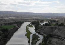 The Colorado River flows towards Horsethief Canyon photo