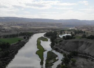 The Colorado River flows towards Horsethief Canyon photo